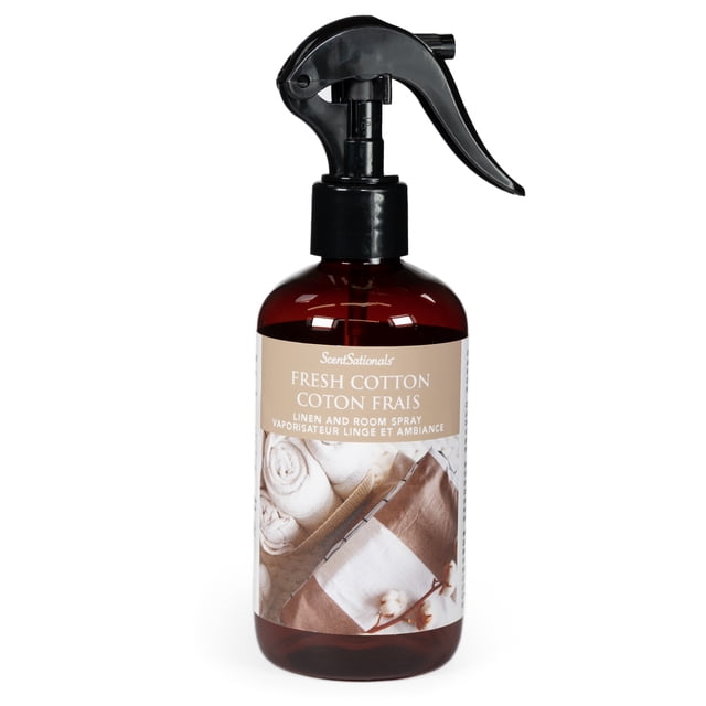 ScentSationals Room Spray - Fresh Cotton in a brown translucent bottle with black trigger spray, labeled with beige showing rolled white linens and cotton fabric, essential oil infused for home fragrance, linen spray, and aromatherapy to create a relaxing atmosphere.
