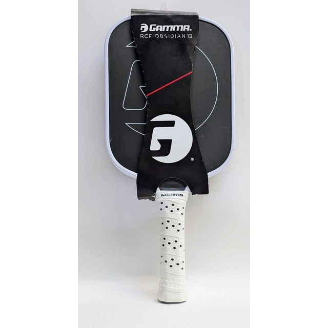 Gamma RCF Obsidian 13mm Pickleball Paddle with a raw carbon fiber surface for precision control and power. The paddle features a black face with a white edge, a molded foam handle wrapped in perforated white grip tape, and a bold Gamma logo on the face. Ideal for tournament players, it offers maximum spin, stability, and customizable weight end caps for tailored performance. Suitable for competitive pickleball play.