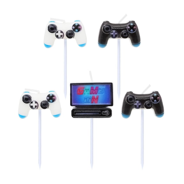GAME ON CANDLE set with five birthday candles shaped like classic game controllers in black and white with blue accents, plus a gaming console candle displaying 'GAME ON' text, perfect for gaming-themed birthday celebrations.