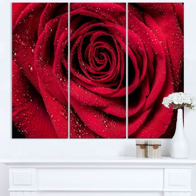 Design Art Red Rose Petals with Rain Droplets Floral Canvas Art Print featuring a three-panel gallery wrapped canvas with a close-up of red rose petals covered in rain droplets, printed on high-quality cotton canvas and ready to hang, suitable for adding vibrant floral décor to home or office spaces.