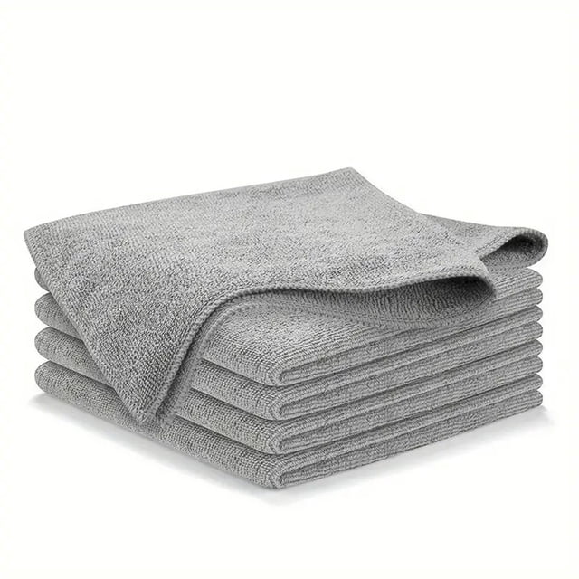 A stack of grey kitchen cleaning cloths, designed for multifunctional use such as wiping damp tabletops, absorbing water splashes, and removing stubborn stains. These thickened, absorbent cloths are durable and suitable for cleaning dishes, countertops, and baby utensils. Each cloth measures 25 cm and is made from safe, chemical-free materials.