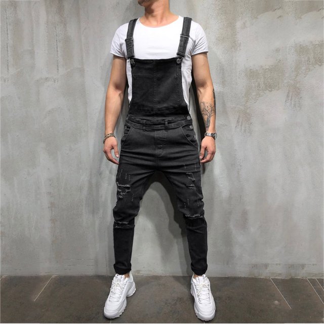 EGNMCR Men's Pants, full-length denim bib overalls in a washed black finish with a casual ripped design. Features adjustable straps, multiple pockets, and a relaxed fit. Styled with a white t-shirt and white sneakers, suitable for casual or daily wear in autumn and winter.