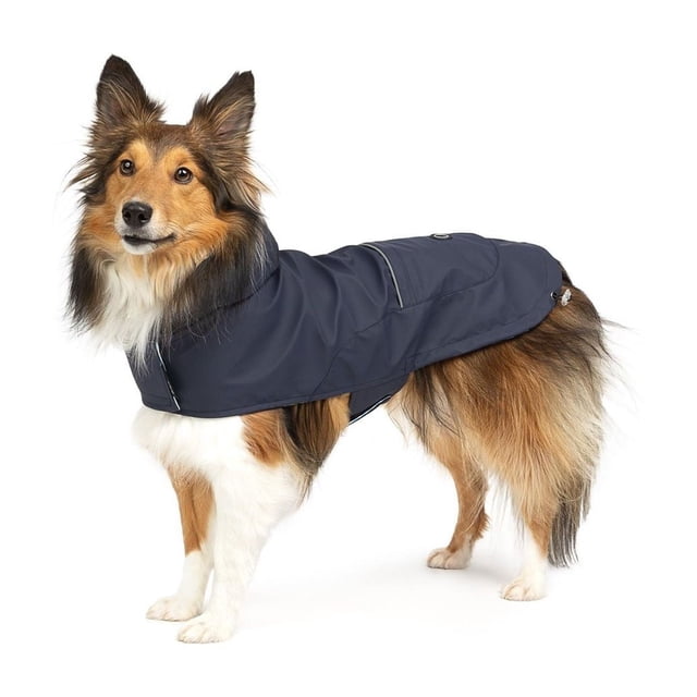 One Paw dog raincoat in navy on a medium-sized dog, made with water-resistant vinyl and reflective trim for visibility, featuring a cozy jersey lining for warmth, ideal for protecting pets during rainy walks.
