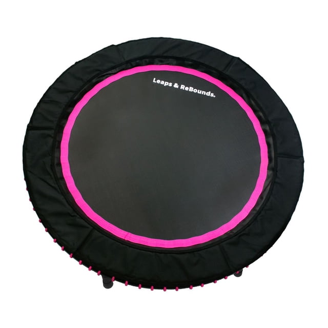 LEAPS & REBOUNDS 48" Mini Fitness Trampoline & Rebounder for Adults in pink, featuring a 48-inch round surface with a black zero-stretch mat and pink accents. Designed with a carbon steel frame and screw-on legs for durability and portability. Ideal for low-impact cardiovascular workouts, improving balance and coordination, and supporting users up to 270 pounds. Quiet bungees ensure a firm bounce without noise, and the UV-resistant mat maintains colorfastness.