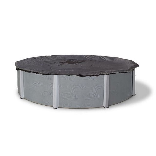 Blue Wave Round Rugged Mesh Above-Ground Pool Winter Cover fitted over a round above-ground pool, made of black mesh that allows water drainage while blocking debris, with reinforced double-stitched hems, metal grommets spaced every 2 feet, and secured by a vinyl-coated cable and metal winch, helping reduce water loss and chemical costs during winter.
