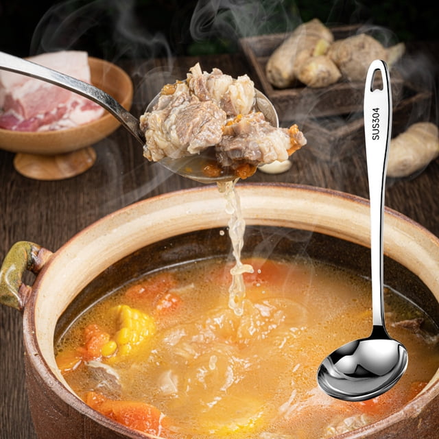 14-inch stainless steel soup ladle with ergonomic vacuum-insulated round handle, shown lifting hearty soup with meat and vegetables from a ceramic pot. This kitchen utensil is made of food-grade 304 stainless steel, rustproof, heat-resistant, and dishwasher safe. Ideal serving spoon for home or restaurant use.