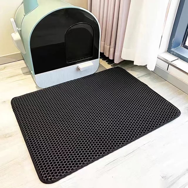 LSLJS Double-layer EVA Non-slip Litter Mat for cats, shown on a light wood floor next to a modern litter box. The mat has a honeycomb design for effective litter trapping, a non-slip backing for stability, and double-layer protection to prevent floor stains. Ideal for cat litter control and home use.