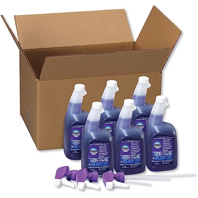 Dawn Professional Heavy Duty Degreaser Spray, 32 oz bottles, packaged in a carton of 6. The image shows six purple spray bottles with white nozzles, labeled as heavy-duty degreaser, placed in front of an open cardboard box. Additional spray nozzles are included in the foreground.