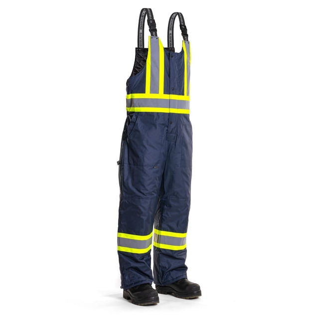 Forcefield Hi-Visibility Winter Safety Overall in navy blue with fluorescent yellow and reflective silver tape on chest, back, and legs, made from tear-resistant polyurethane-coated ripstop fabric with 200 gsm polyfill insulation, featuring adjustable elastic shoulder straps, multiple pockets, and side-leg zips for wind and water resistance and enhanced visibility in winter workwear.