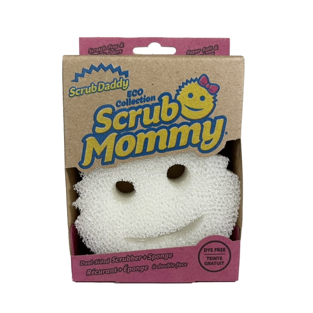 Scrub Daddy Scrub Mommy Dye Free Non-Scratch Cleaning Sponge in eco-friendly cardboard packaging, featuring a white dual-sided kitchen cleaning tool with ergonomic finger holes and a smiley face design, made from dye-free material for scratch-free cleaning on various surfaces.