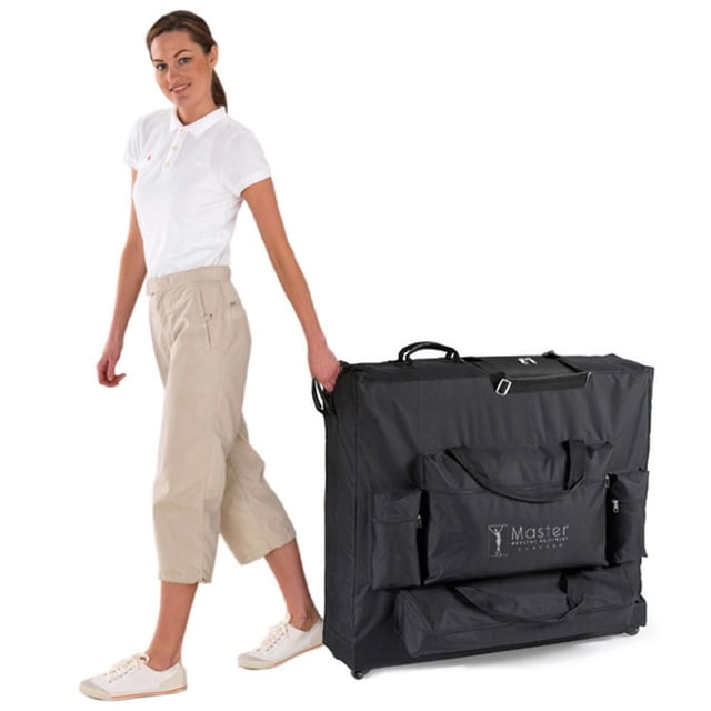 Master Massage - Universal Wheeled Massage Table Carrying Case in black fabric with reinforced handles, four zippered pockets including one for a comfort bolster, and high-impact nylon wheels, shown upright being pulled by a person, fits portable massage tables 25 to 30 inches wide for easy transport and storage.
