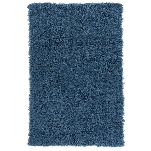New Flokati 1400gr 3'6" x 5'6" Accent Rug in denim blue, hand woven in Greece from 100% New Zealand wool with a deep plush shag pile, perfect for small spaces; often used as a cozy accent in bathrooms or guest bedrooms to add warmth and texture.