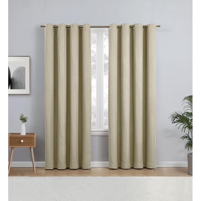 Eclipse Heath 63" grommet blackout window curtains panel in linen colour made of 100% polyester, hanging on a metal rod in a room with light grey walls and wooden floor, featuring a small wooden side table with a white vase and green plant, and a potted plant on the right side, ideal for light reduction, privacy, and noise control.