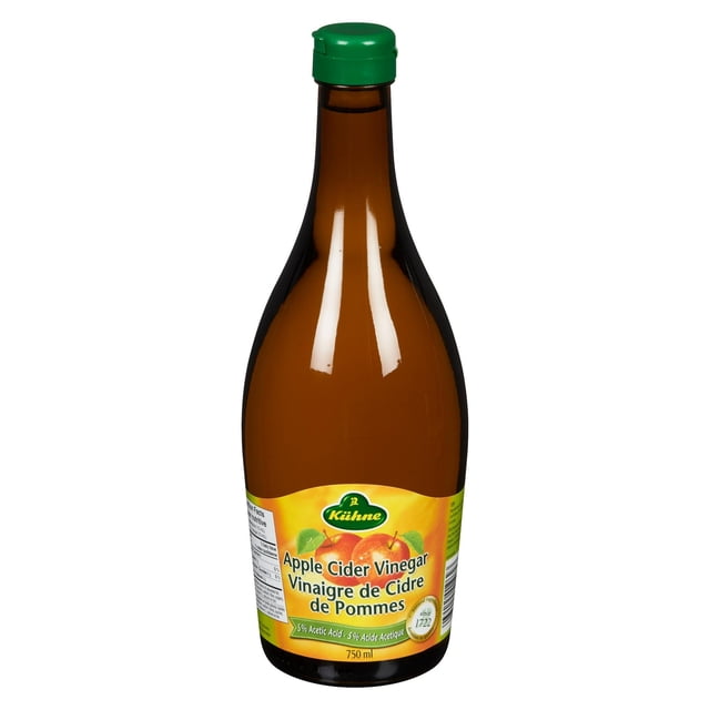 Kuhne Apple Cider Vinegar in a 750 mL amber glass bottle with a green cap, featuring a yellow label with apple illustrations and bilingual text stating 5% acetic acid, ideal for salad dressings and light sauces in Canadian kitchens.