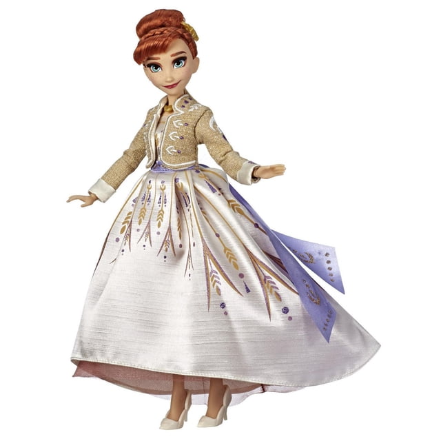 La Reine des Neiges de Disney Arendelle Anna Poupée Mannequin Portant une Robe de Voyage Blanche Scintillante avec Ceinture Violette et Flèches Dorées, Assortie à une Veste Texturée Jaune, une Coiffure Dorée, un Collier et des Chaussures Blanches Amovibles, avec 9 points d'Articulation pour la Pose.