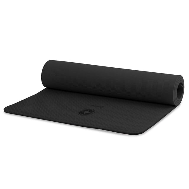 STOTT PILATES Eco-Friendly Mat in black, partially unrolled showing textured wave and diamond patterns, made of recyclable TPE, 0.3 inch (6 mm) thick, 24 by 68 inches, reversible with carry strap, designed for Pilates, yoga, and mat workouts, also suitable for floor stretching.