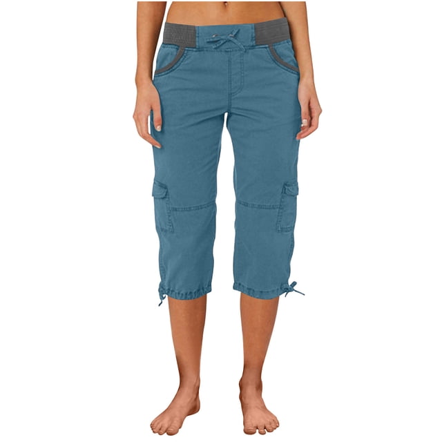 Timegard Womens Cargo Capri Pants with an elastic waistband, drawstring cinch bottom, and multiple pockets. Made from a lightweight blend of 95% polyester and 5% spandex, these blue capri pants are designed for comfort and flexibility, ideal for hiking or casual outings. The pants feature a relaxed fit with side cargo pockets and adjustable hems for a customizable fit.