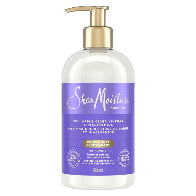 SheaMoisture Anti-Dandruff Conditioner For Soft & Smooth Hair Apple Cider Vinegar & Salicylic Acid System for a Healthier Scalp 384 ml in a clear pump bottle with gold dispenser and purple label highlighting apple cider vinegar, niacinamide, and pyrithione zinc to hydrate hair and soothe dry scalp, suitable for dandruff relief and scalp care.
