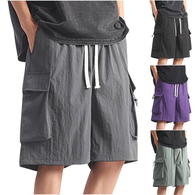 Hurxie Deals Basketball Shorts Men Big And Tall Gym Shorts Mens 4x Athletic Shorts Men with Pockets XXXXL. These men's shorts are made of breathable polyester fabric, featuring a relaxed fit with roomy hips and thighs, straight legs, and multiple pockets for convenience. The image shows the shorts in grey, black, purple, and green color options, with a drawstring waistband for adjustable comfort. Suitable for basketball, gym, running, or casual daily wear.