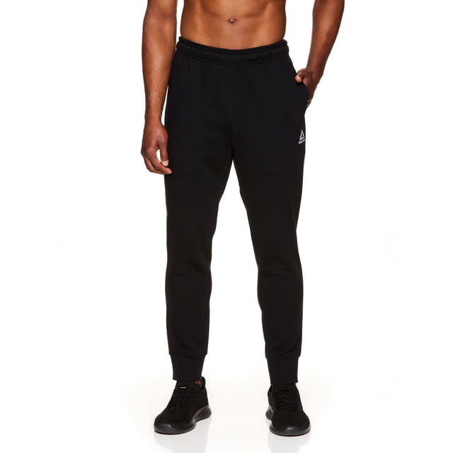 Reebok Jogger en Molleton Delta pour Hommes, Noir, avec Jambes Fuselées Pleine Longueur, Taille Élastique avec Cordon de Serrage de Marque, Poches Latérales et Zippées, et Poignets Côtelés, en Molleton Doux Coton-Polyester, Convient aux Tenues Décontractées et Actives dans les joggers pour Hommes.
