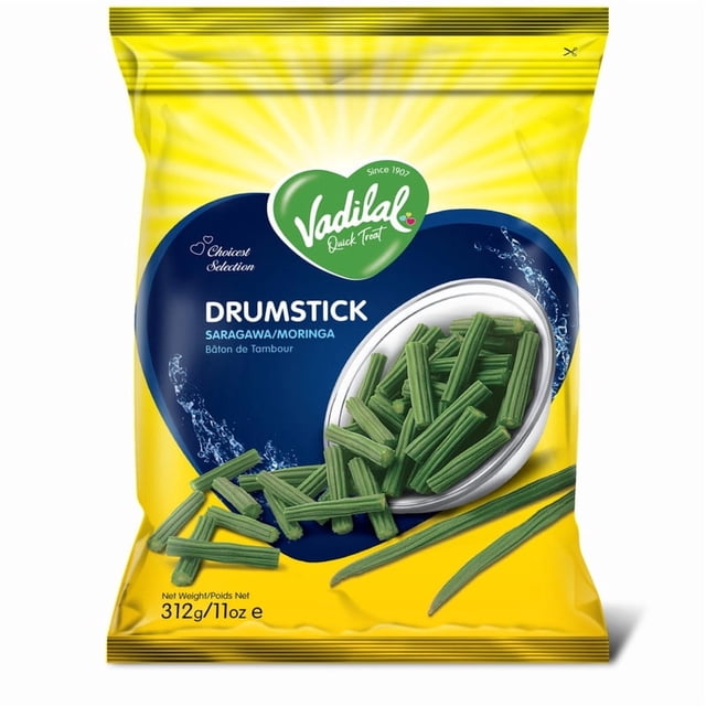 Vadilal Drumstick frozen moringa vegetable package with green drumstick pieces spilling from a white bowl on a yellow background featuring a blue heart-shaped label, net weight 312g (11oz), authentic Indian food with no eggs, preservatives, or artificial flavors.