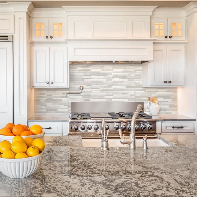 SMART TILES PEEL & STICK BACKSPLASH - MILANO FABRINI - 4 Pieces 11.55 x 9.63 front-facing 2x2 display of four self-adhesive rectangular tiles with a matte white and light grey geometric motif and grout-line texture; peel-back corner reveals adhesive layer, sized for DIY kitchen or bathroom backsplash installation, heat resistant for stovetop areas and not suitable for inside the shower. Often used as a removable accent panel for rental or craft projects.