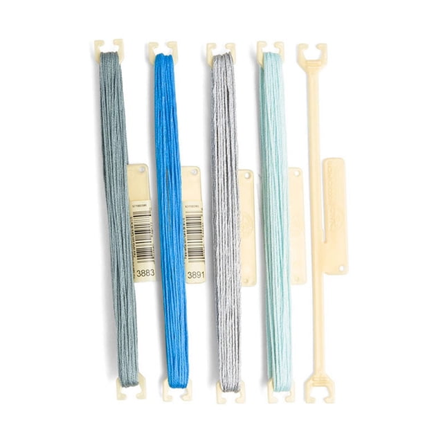 DMC StitchBow Floss Holder – 10 Pack featuring four plastic holders loaded with embroidery floss in grey, blue, silver, and light teal, plus two empty holders, arranged vertically on a white background, designed for organizing and storing art supplies and embroidery threads to keep skeins tangle-free and ready to use.