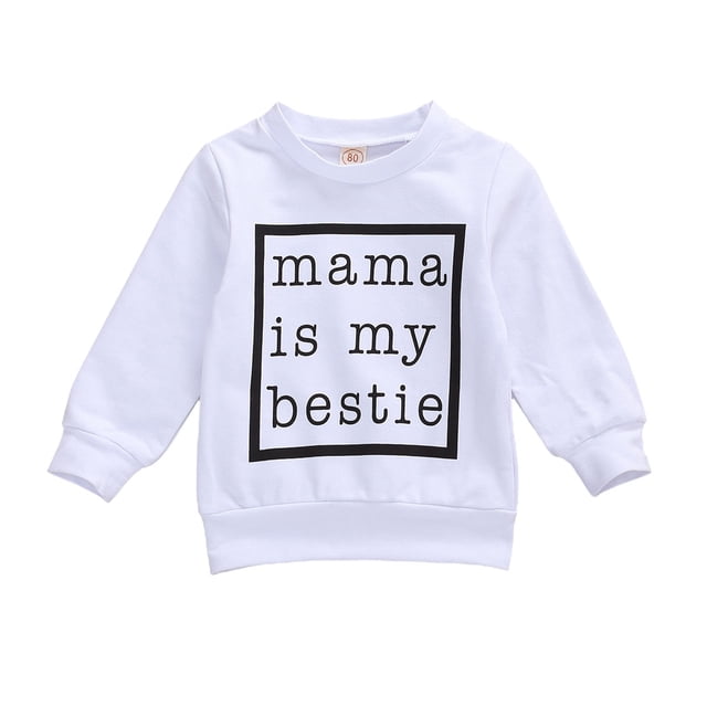 Chandail à Enfiler pour Bébé avec Inscription « Maman Est Ma Meilleure Amie », Doté d'Un Col Rond Classique et de Poignets Côtelés. Fabriqué en Doux Coton Blanc, Convient aux Vêtements pour Bébé de 0 à 24 Mois. Parfait pour les Tenues Décontractées, les Chandails pour Bébé et les Tenues Saisonnières au Printemps, en Automne et en Hiver.