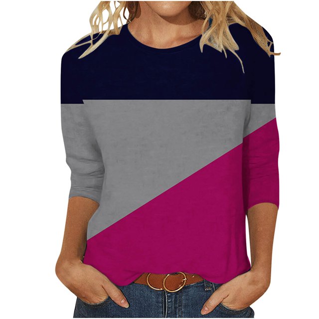 FAIWAD Women's 3/4 Sleeve Tunic Tops featuring a round neck and a color block design in navy, grey, and magenta. The loose fit and lightweight polyester material provide comfort and breathability, making it suitable for casual and trendy spring or summer wear. Shown paired with jeans and a belt.
