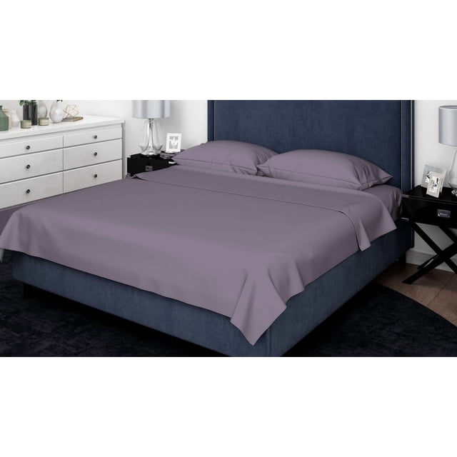 Johnson Home 450 Thread Count Bamboo Bed Sheet Set in muted purple on a navy blue upholstered bed with a tall headboard. Includes a flat sheet and two pillowcases made from breathable, wrinkle-resistant bamboo fabric that regulates temperature and offers hypoallergenic comfort, ideal for year-round use.