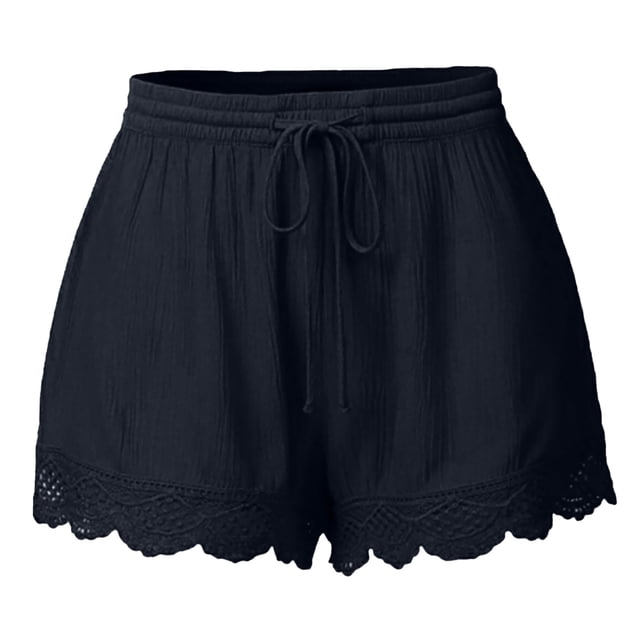 Timegard Plus Size Shorts for Women featuring a wide-leg design with an elastic waistband and drawstring. These solid-color casual shorts are made from a lightweight blend of 95% polyester and 5% spandex, offering a breathable and soft texture. The lace ruffle hem adds a feminine touch, making them suitable for lounging or outdoor activities. Shown in a dark color with intricate lace detailing at the hem.
