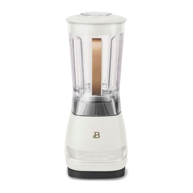 Beautiful High Performance Touchscreen Blender by Drew Barrymore with a white base and clear 6-cup BPA-free Tritan pitcher featuring a gold handle and touch-activated display, powered by a 1 horsepower motor with presets for smoothies, ice crushing, and auto-clean function.
