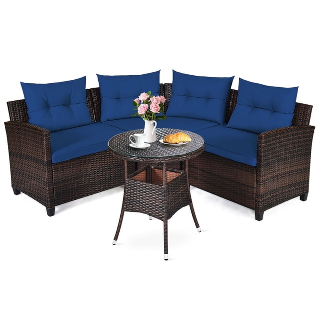 Patiojoy 4PCS Outdoor Patio Conversation Set featuring a wicker rattan sectional sofa with navy cushions and a round coffee table with a tempered glass top. The set includes a left armrest chair, right armrest chair, middle sofa, and coffee table, all crafted with a steel frame and hand-woven PE rattan in a dark brown finish. The navy cushions are removable with zippered covers for easy cleaning. Ideal for outdoor spaces like patios, balconies, and poolside areas.