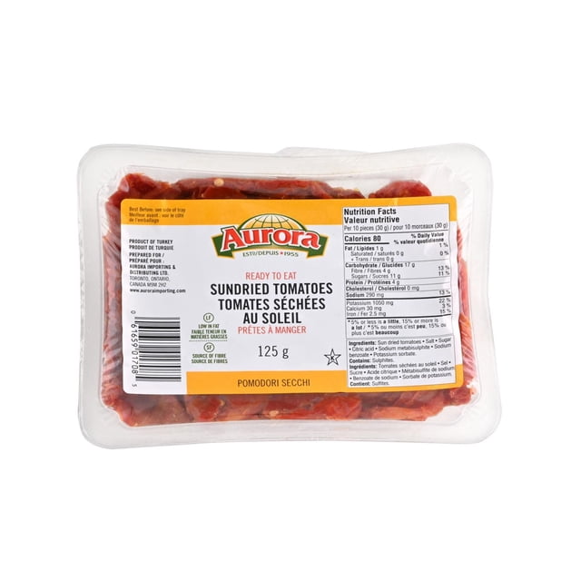 Tomates Séchées au Soleil - Prêtes à Manger par Aurora dans un Plateau en Plastique Transparent de 125 g avec une Étiquette Blanche et Jaune Indiquant les Faits Nutritifs et les Ingrédients, Mettant en Vedette des Tomates Séchées au Soleil à Saveur Naturelle intense, Idéales pour Rehausser les sauces, les Salades et les Pâtes en Cuisine.