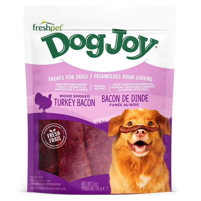 Freshpet Dog Treat, Dog Joy Wood-Smoked Turkey Bacon Treat 85 gm resealable bag containing natural, grain-free turkey bacon jerky treats for dogs, fully cooked and ready to serve, shown with a happy golden dog balancing a treat on its nose, suitable for rewarding pets.