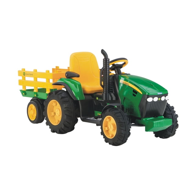 Peg Perego John Deere Ground Force Ride-on Tractor with Trailer with green and yellow plastic body, large black farm tractor wheels, yellow adjustable seat with flip-up armrests, full-size detachable yellow trailer with side rails, black exhaust pipe, 12-volt rechargeable battery, two speeds, and FM radio for outdoor play.