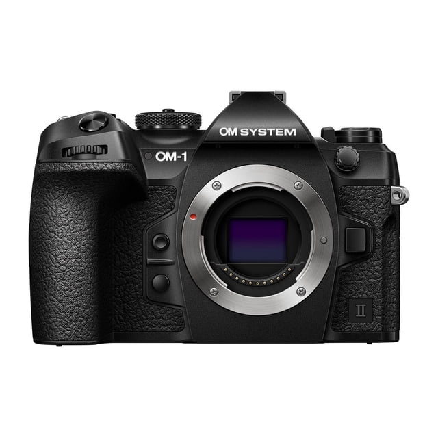 OM System OM-1 Mark II Mirrorless Camera (Body Only) front view featuring black textured grip, silver lens mount with visible sensor, control dials, and OM SYSTEM branding on the pentaprism housing, suitable for high-speed nature and wildlife photography.