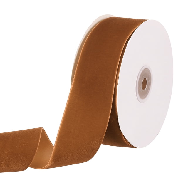 Unique Bargains 1-1/2' 10 Yard Velvet Ribbon Polyester Single Face Spool in khaki colour, featuring a soft velvet texture with a polyester backing. The ribbon is partially unrolled from the spool, showcasing its smooth finish and single-sided design. Suitable for DIY crafts, wedding decorations, gift wrapping, and floral arrangements.