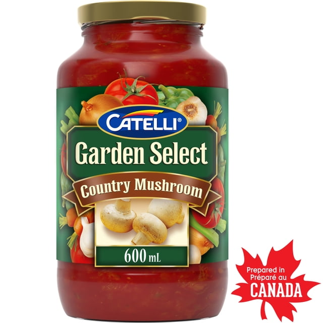 Catelli Garden Select Sauce pour Pâtes aux Champignons de Style Campagnard dans un Pot en Verre de 600 ml avec Couvercle Doré, Présentant une Étiquette Verte avec des Tomates, des Oignons, de l'Ail, des Poivrons Verts et des Champignons, Préparée au Canada. Cette Sauce Épaisse et Volumineuse à Base de Tomate Offre une Saveur de Champignon Profonde, un Mélange de six Légumes du Jardin, d'Herbes et Est Faible en Gras, Convient aux Plats de Pâtes et aux Aliments Chauds et Confortables.