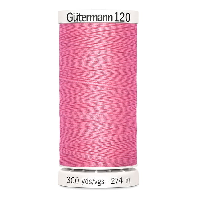 Gutermann 120 100% polyester all purpose sewing thread spool in pink, tightly wound with label showing 300 yards (274 meters). Suitable for machine and hand sewing on cotton, synthetics, and craft projects.