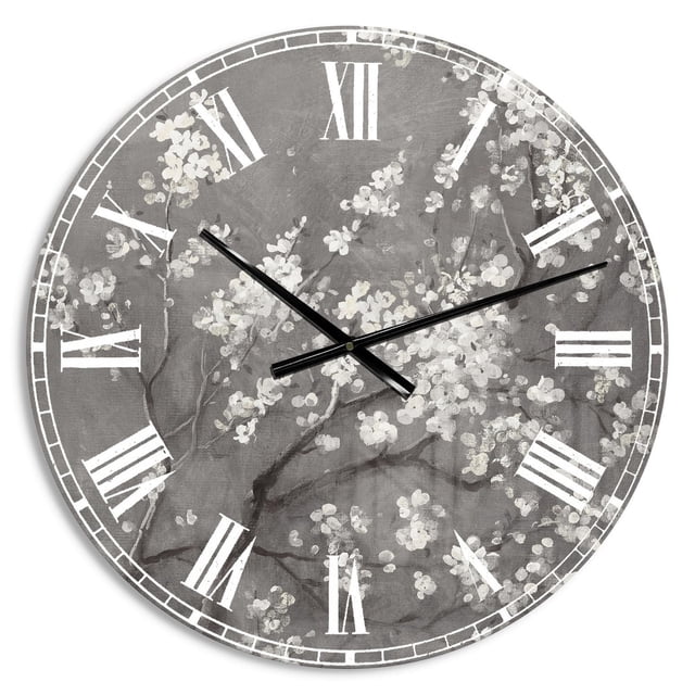 Designart 'White Cherry Blossoms I' Traditional wall clock, round with white cherry blossom branches on a grey background, white Roman numerals, and black hands, made of glossy solid aluminum with a reflective finish, ideal as a modern oversized clock for home décor.