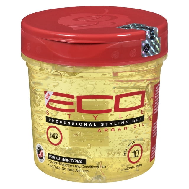 Eco Style Gel à l'Huile d'Argan, un Gel Coiffant de 473 ml avec Couvercle Rouge et Contenant Transparent Affichant le Gel. l'Étiquette Met l'Accent sur une Formule Sans Alcool, Tenue Maximale de 10/11, et Convient à Tous les types de Cheveux. Enrichi d'Acides Gras Essentiels et de Vitamine E pour Nourrir, Réparer, Revitaliser, Définir, Hydrater, Lisser et Ajouter de la Brillance aux Cheveux. Idéal pour Coiffer et Maintenir des Coiffures Épurées.