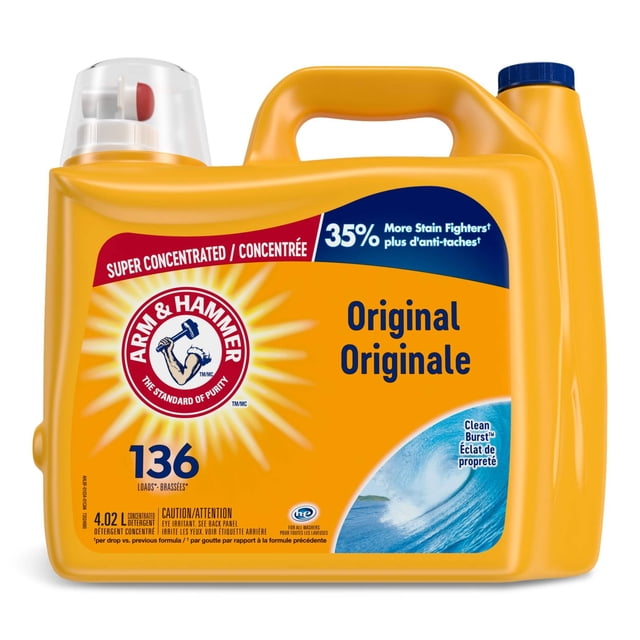 Arm & Hammer Cold Water Liquid Laundry Detergent, Clean Burst, 136-Load, 4.02-L. The detergent is packaged in a bright yellow container with a built-in handle and a red and white dispensing cap. The label highlights its super-concentrated formula with 35% more stain fighters per drop compared to the previous formula. Suitable for both standard and high-efficiency washers, it features a low-suds formula for a clean rinse and includes pure baking soda for stain removal and brightening clothes. The container is designed to handle approximately 136 loads.