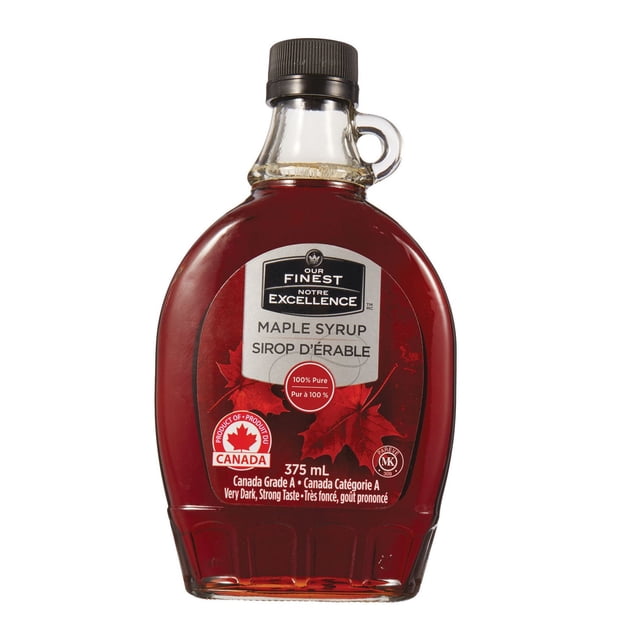 Our Finest 100% Pure Maple Syrup Canada Grade A Very Dark, Strong Taste in a 375 mL clear glass bottle with black screw cap and loop handle, featuring a red label with maple leaves and bilingual text emphasizing its pure Canadian origin and rich flavour, often used for pancakes and waffles.