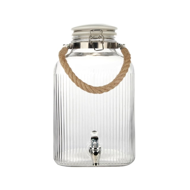 Hometrends Clear Ribbed Glass Beverage Dispenser, 2-gallon capacity, with a rectangular ribbed glass body, ceramic tight-seal lid, natural rope handle, and chrome spigot, suitable for serving cold drinks like lemonade or infused water at gatherings.