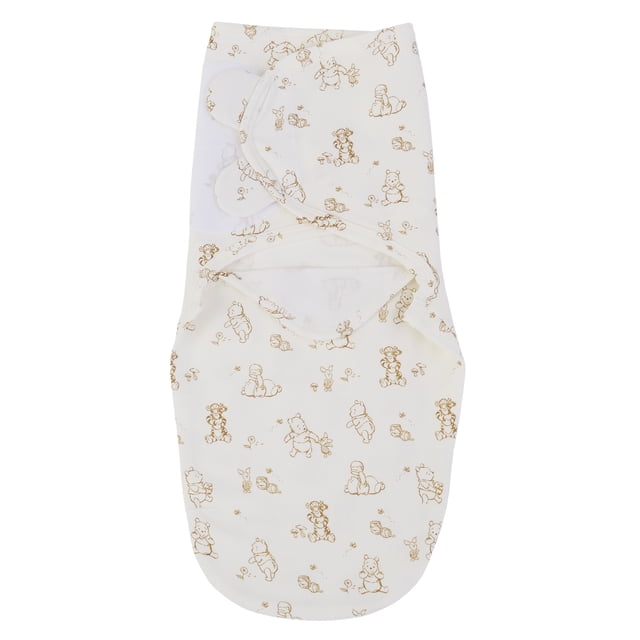 Disney Winnie the Pooh Adjustable Swaddle Wrap, Ivory, Brown, Infant Unisex, Cotton front-facing view of an ivory 100% cotton interlock swaddle featuring an all-over print of Pooh, Tigger and Piglet with visible hook-and-loop closures; designed for newborns who cannot roll over from back to stomach.