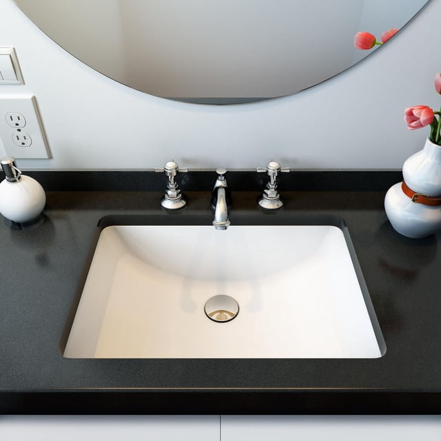 A&E Bath and Shower FUSION Évier sous Lavabo en Céramique avec un Ensemble de Cuvette Rectangulaire Blanche en Comptoir Noir, Doté d'Un Robinet à Double Poignée en chrome Poli et d'Un Débordement Intégré avec Anneau Décoratif, Illustré sous un Miroir Rond avec un Distributeur de Savon Blanc et un vase Blanc Tenant des Tulipes Roses, Convient à la Rénovation de Cuisine et à l'Utilisation sous Évier de Cuisine.