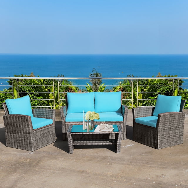 Costway Ensemble de Mobilier de Patio en Rotin 4 Pcs Table de Sofa avec Tablette de Rangement Turquoise Exposé dans un Décor de Patio Extérieur. Comprend Deux Fauteuils, un Causeuse et une Table Basse avec Dessus en Verre Trempé et Tablette de Rangement. Fait de Rotin Gris Mélangé avec Coussins Turquoise, Cet Ensemble de conversation Est Idéal pour s'Asseoir à l'Extérieur sur les patios, Jardins Ou au Bord de la Piscine.
