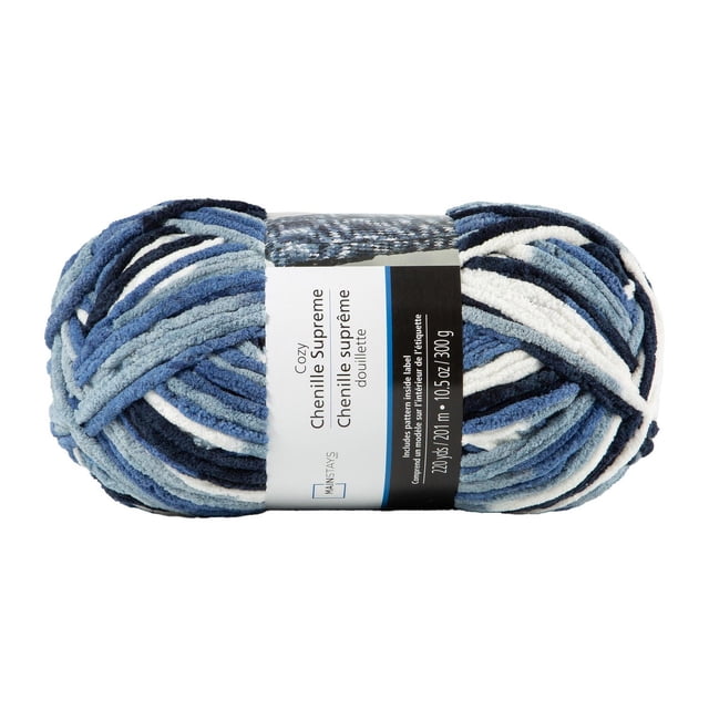 MAINSTAYS Cozy Warm Denim Blue chenille Yarn skein in variegated blue, navy, white, and grey polyester chenille yarn, weighing 10.5 oz (300 g) with 220 yards (201 m), wrapped with a label including pattern instructions, ideal for knitting cozy blankets, pillows, and scarves.