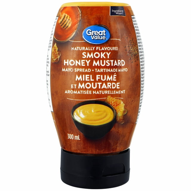 Great Value Naturally Flavoured Smoky Honey Mustard Mayo Spread in a 300 mL squeezable bottle with a black flip-top cap, featuring a brown label with images of honeycomb, mustard seeds, and a bowl of creamy yellow mayo, suitable for sandwiches, marinades, and as a dip for vegetables and snacks.